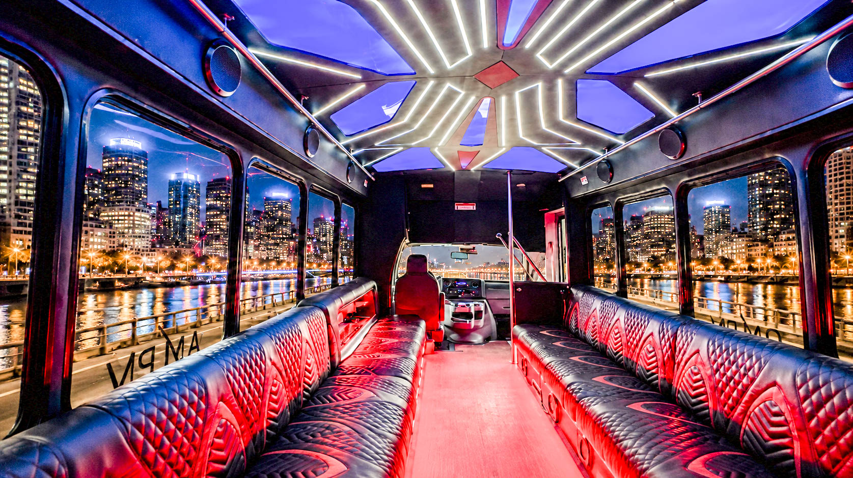 image of 28 passenger white Party Bus interior taken from side bench seat near front door